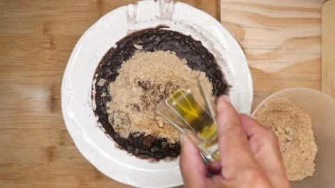Feijoada (beans, pork ,manioc flour and olive oil. A classic.  Brazilian dish Stock Footage 219839996