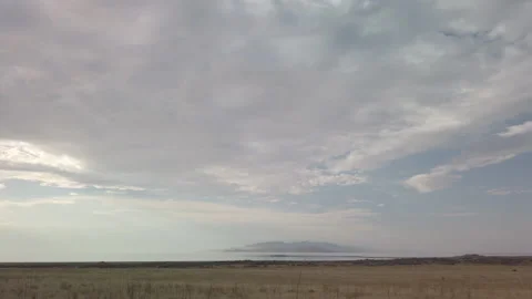 Feild Leads to Lake UHD Stock Footage 176050842