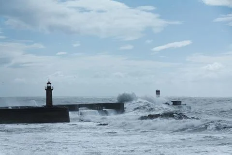 Felgueiras lighthouse being battered by stormy sea waves in Porto, Portugal Stock Photos
