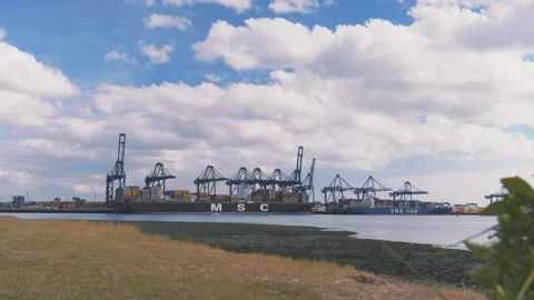 Felixstowe docks container ship and river Stock Footage