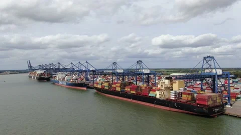 Felixstowe Port Three Large container ships loading 4K drone footage 動画素材 138799449