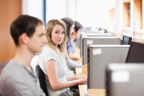 Fellow students using a computer 스톡 사진