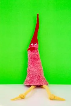 Felt hand puppet shaped as funny pink creature Stock Photos