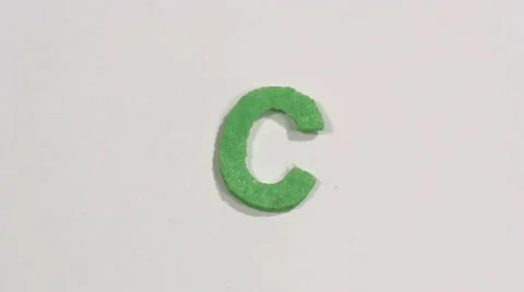 Felt letter “C” on white background. Defocus Stock Footage 60250484