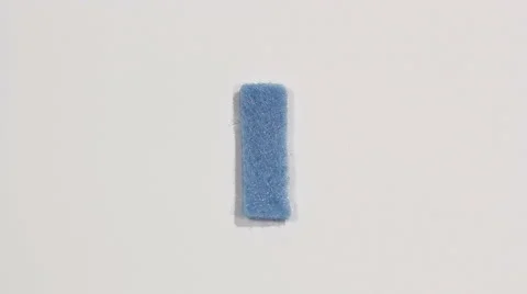Felt letter “I” on white background. Defocus Stock Footage 60251012