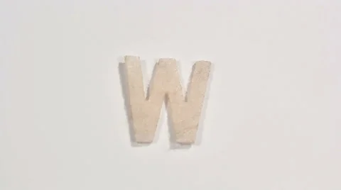 Felt letter “W” on white background. Defocus Stock Footage 60252155