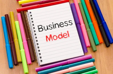 Felt-tip pen and notepad and business model text concept Stock Photos