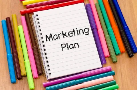 Felt-tip pen and notepad and marketing plan text concept Stock Photos