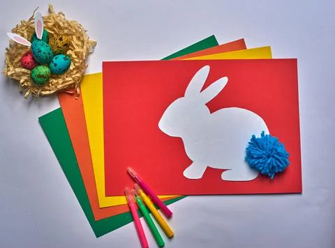 Felt-tip pens and easter white bunny with easter eggs Stock Photos