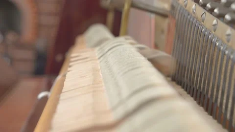 Felted mallets actively strike strings to produce sound or music when a person 스톡 동영상 158902213