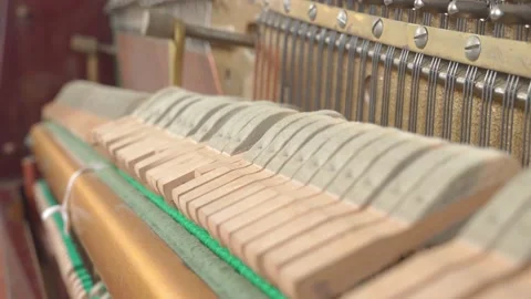 Felted mallets strike strings to produce sound or music when a person plays the 스톡 동영상 155769965