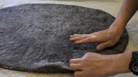 Felting wool cushions using a soap solution Stock Footage 279151556