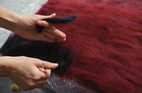 Felting wool by hand. Stock Photos