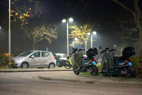 Felyx Shared Dockless Electric Scooters on Parking Lot Foto stock