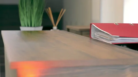 A female accountant takes a folder with documents from the table close-up Stock Footage 235134383