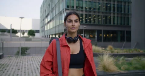 Female aerobics instructor being on her way to stadium has self confident Stock Footage 160204944