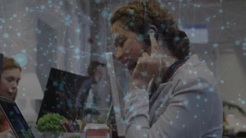Female agent putting on headset, initiating support call while typing, network Stock Footage 330768057