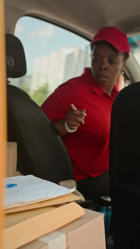 Female Agent Taking Parcel from Backseat when Delivering by Car Stock Footage 280378758