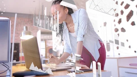Female analyst analyzing laptop data, leaning, typing and writing notebook while Stock Footage 333552669