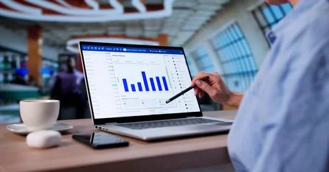 Female Analyst Examining Data On Laptop For Business Software Development Stock Photos