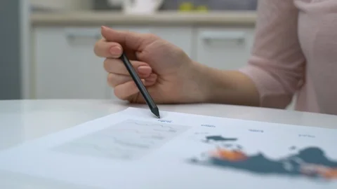 Female analyst working at report in office, analyzing statistics, comparing data Stock Footage 122428857