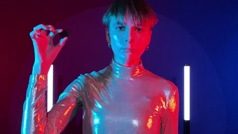 Female android cyborg shows cybernetic implant augmentation to camera Stock Footage 239607606