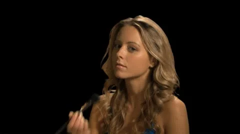 Female applying make up Stock Footage 8948309