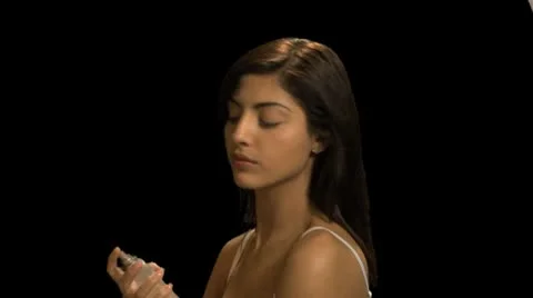 Female applying perfume Stock Footage 8948313