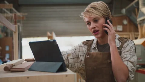 Female Apprentice Carpenter With Digital Tablet Working In Furniture Workshop 스톡 동영상 242293477