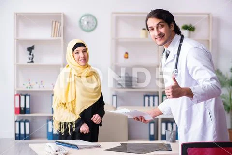 Female arab patient visiting male doctor Stock Photos