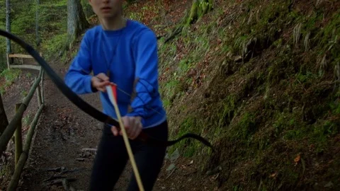 Female archer hunting in the forest 動画素材 80473224