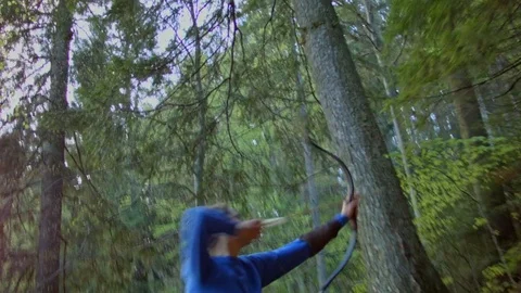 Female archer hunting in the forest Stock Footage 80487357