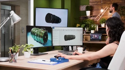 Female architec works in 3D software on new turbine prototypes Stock Footage 111521664