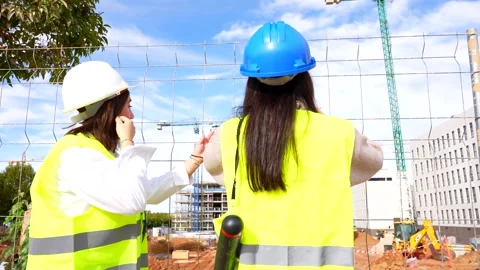 Female architect and engineer working on construction site Stock Footage 334582929