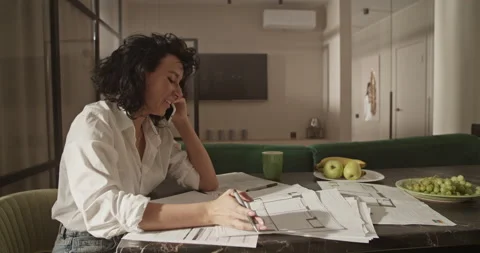 Female architect discussing drafts with client Stock Footage 207674391