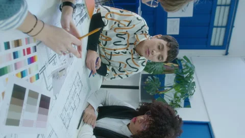 Female Architect Discussing Floor Plan with Team at Office Meeting Stock Footage 248183259
