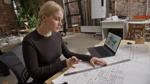 Female Architect Drawing Floor Plan and Reviewing Digital 3D House Design Stock Footage 327850314