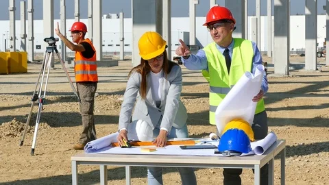 Female architect, engineer and manager on construction site, teamwork Stock Footage 119339417