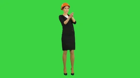 Female architect in hardhat making funny dancing on a Green Screen, Chroma Key 動画素材 71755032