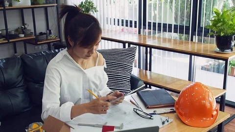 Female Architect Or Engineer working with tablet. Architectural Concept. Stock Footage 117330087