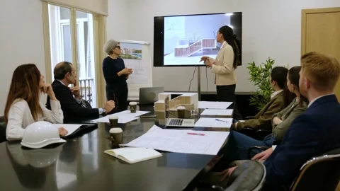 Female architect presenting project in business meeting Stock Footage 340085154