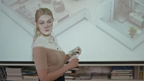 Female Architect Presenting Successful 3D Digital Building Plan to Team Stock Footage 327851192