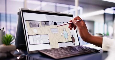 Female Architect Using Digital Tablet to Analyze Floor Plan Stock Photos
