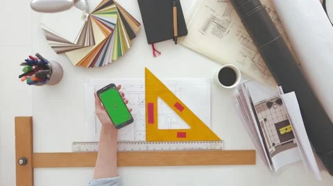 Female architect using mobile phone, taking notes Stock Footage 63964795