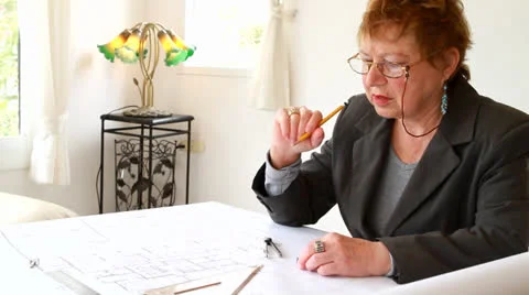 Female architect working on architectural plan Stockbeeldmateriaal 22559201