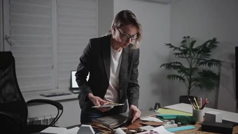 Female architect working on interior design project. Using Palettes and Texture Stock Footage 297049773