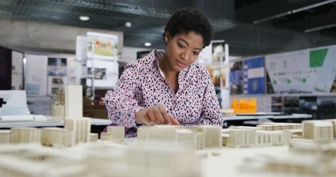 Female architect working on model Stock Footage 86805237