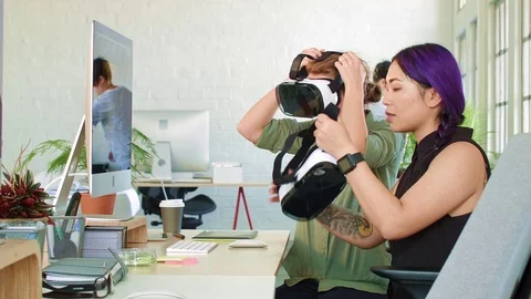 Female architects doing walk-throughs with virtual reality headsets Stock Footage 71632485