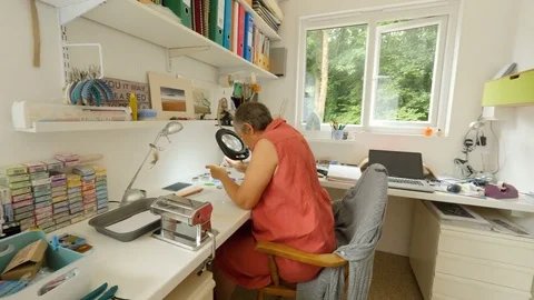 Female artiest makes polymer clay buttons Stock Footage