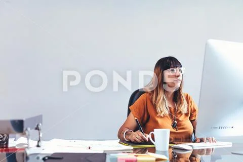Female artist working in office Stock Photos